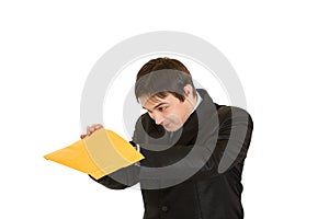 Interested young businessman checking parcel