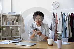 Interested young woman florist contacting customer to discuss order details