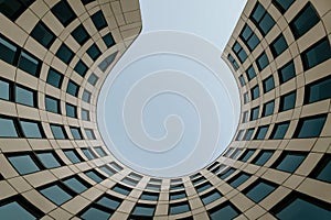 Unique architectural design creates a circular view of the sky in an urban setting