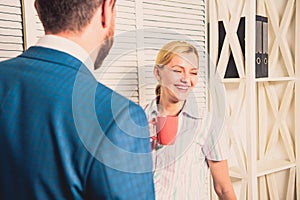 Interesting conversation. Bearded man and woman talking. Couple conversation during lunch time. Office rumors. Office