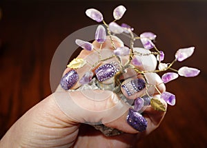 Interesting holiday nail art design with purple glitter