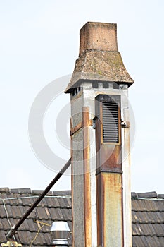 A interesting old flue above a roof