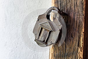 Interesting old padlock on a wooden medieval door.
