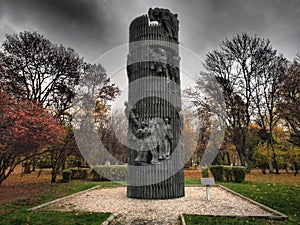 interesting park, metal bench and in autumn many monuments in the area photo