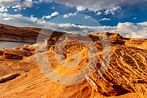 Interesting plates and layers of rock shining under the evening sun, The Chains, Page, Arizona, USA