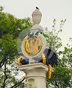 Interesting statue of an eagles, symbol and golden wreaths
