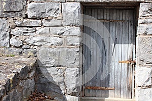 Interesting stone building with carved wood door