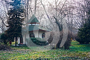 An interesting teahouse building in Bulgaria. Teahouse, souvenir shop in a park between trees.