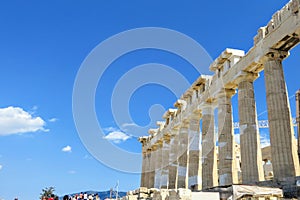 An interesting view of the Parthenon columns facing a blue sky atop the Acropolis in Greece.