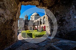 Interesting View Through a Window Through Thick Stone Walls of the Court Yard of the Historic Old West Spanish Mission San Jose