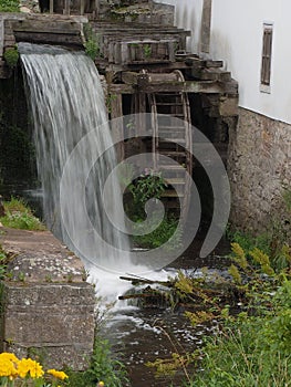 An interesting water mill with interesting nature in the surroundings in a beautiful grandmother`s valley