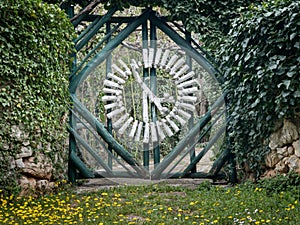 Interesting wooden green white garden gate in Croatia