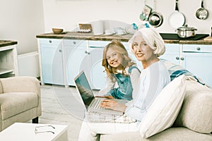 Intergenerational Relationship Granny And Little Girl Using Laptop