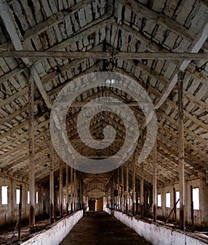 Interior of abandoned barn with beautiful wooden