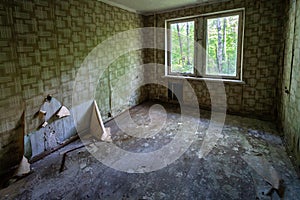 Interior of abandoned Room with wallpaper at Living Apartments of Duga Radar Village - Chernobyl Exclusion Zone, Ukraine