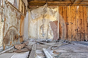 The interior of an abandoned shack at a mining ghost town in the desert of Nevada, USA