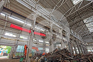 Interior of abandoned steel frame workshop factory building in industrial area