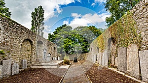Interior of Abbey Graveyard with a path in the middle and tombstones in the town of Athlone