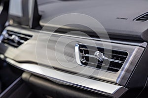 interior air duct on the front panel of a premium car