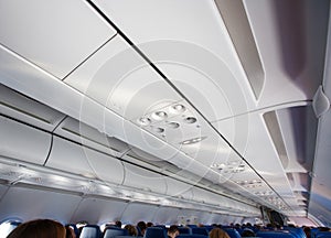 Interior of the aircraft cabin, ceiling, ventilation system.