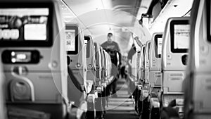 Interior of airplane with passengers on seats waiting to taik off.