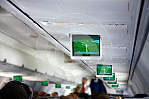 Interior of airplane with telescreens