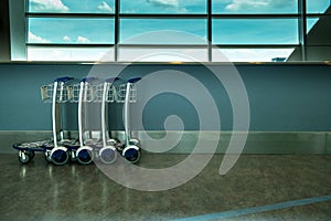 Interior airport luggage cart or trolley of departure lounge at the airport