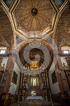 Interior and the altar of the Church of St. Michael (Parroquia de San Miguel Arcangel) in Mexico photo