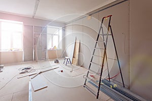 Interior of apartment during construction, remodeling, renovation, extension, restoration and reconstruction - ladde