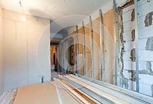 Interior of apartment with materials during on the renovation making wall from gypsum plasterboard