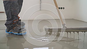Interior of apartment under construction. Mirror smooth surface of the floor. Floor covering with self leveling cement mortar. photo