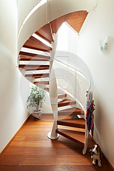 Interior of apartment with wooden spiral staircase