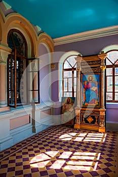 The interior of the Assumption-Bogoroditsky Monastery. Arched windows, rays of light and bright wall colors. Sviyazhsk. Kazan.