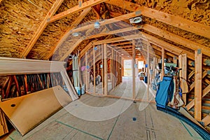 Interior of the attic of a house with pitched roof and used as storage space