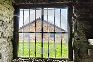 Interior of barrack with Prisoner`s beds, bunks inside barrack in Auschwitz Birkenau. Nazi concentration camp Auschwitz II, built