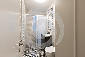 Interior of a bathroom with shower cabin