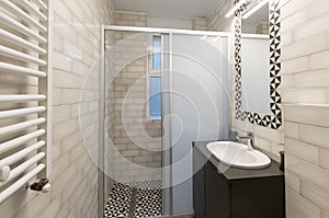 Interior of a bathroom with shower cabin