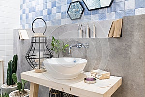 Interior of bathroom with sink basin faucet and mirror. Modern d