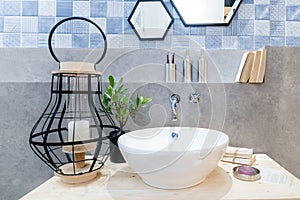 Interior of bathroom with sink basin faucet and mirror. Modern d