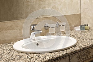 Interior bathroom with sink basin faucet, open chrome faucet washbasin. modern design of bathroom