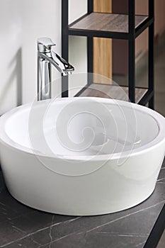 Interior of bathroom with washbasin and faucet. Bathroom interior sink with stoneware countertop modern flat