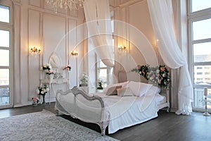 The interior of a beautiful bedroom Suite in bright white.