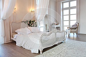 The interior of a beautiful bedroom Suite in bright white.