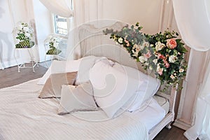 The interior of a beautiful bedroom Suite in bright white.