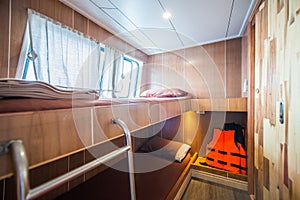 Interior of a bedroom on a liveaboard dive boats