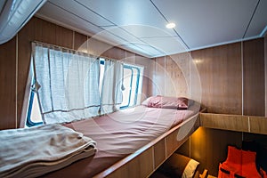 Interior of a bedroom on a liveaboard dive boats