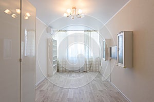 Interior of a bedroom partially freed from furniture due to relocation