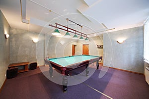 Interior of a billiard room with a pool table