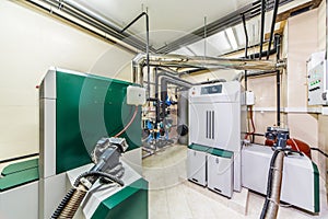 Interior boiler with two boilers with fuel from wood auger