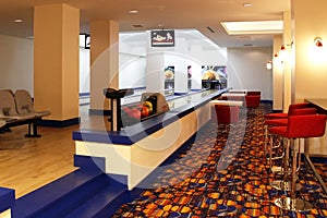 Interior of bowling center with two bowling lanes